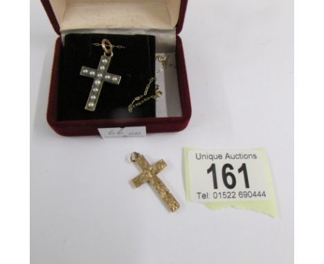 A vintage pearl set cross in gold tested together with a further cross in 9ct gold.