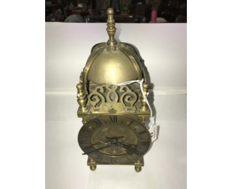 A brass lantern clock. ****Condition report**** Spring ok but needs cleaning