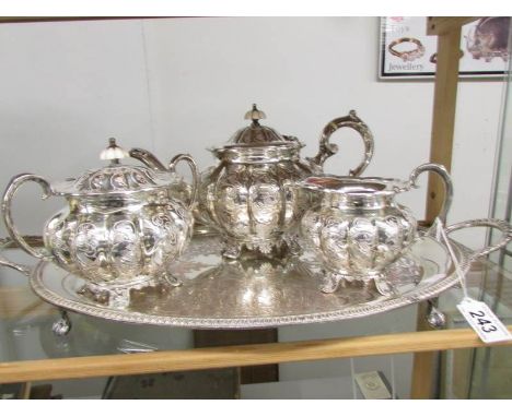 An ornate 3 piece chased Sheffield plate tea set on tray,.