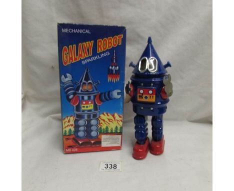 A tinplate clockwork Galaxy robot in original box.