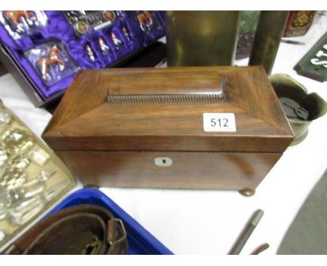 A Victorian rosewood tea caddy (missing glass bowl).