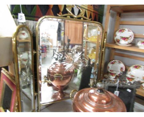 A triple brass fire screen set with star cut mirrors.