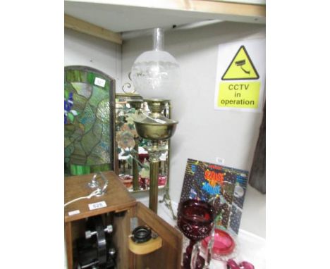 A brass Corinthian column oil lamp with etched glass shade.