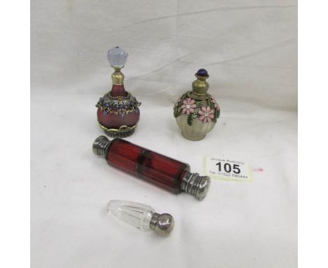 A double ended ruby glass scent bottle with plated fittings, a small cut glass scent bottle with silver top and 2 others.