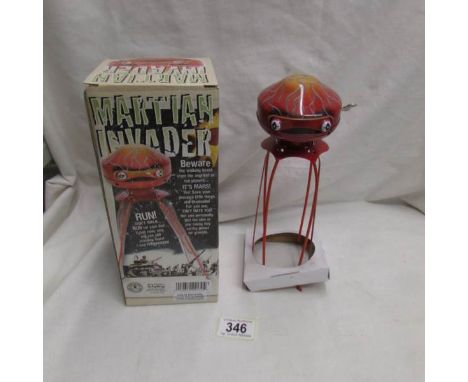 A boxed Schylling Martian Invader tinplate clockwork robot.