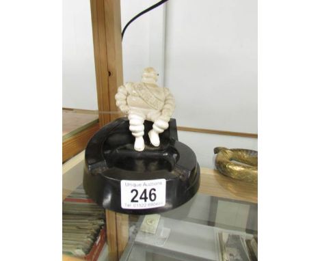 A vintage bakelite Michelin man ashtray, base a/f. ****Condition report**** Fair condition but has a large piece missing from