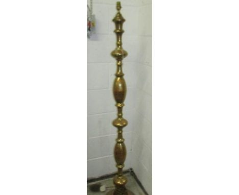 A brass standard lamp base.