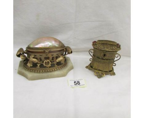 A Palais Royal gilt money box and a mother of pearl and gilt ring box.