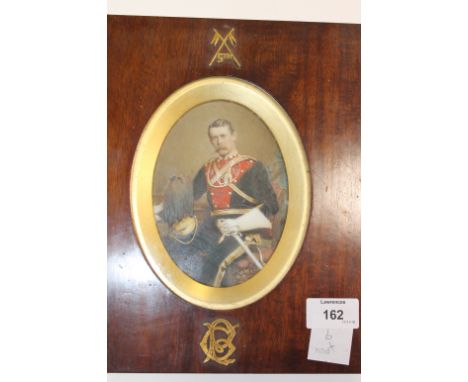 A FRAMED PORTRAIT OF A 5th LANCERS OFFICER. A mahogany framed hand tinted over glass photograph, of a formally posed Fifth La