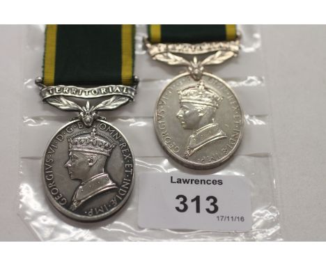 TWO GV1 EFFICIENCY MEDALS. 1. With top bar Territorial named to 1444385 Bdr F S Davis R. A.  2. With top bar Territorial name