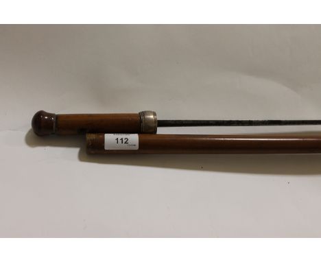 A SWORDSTICK. A cane swordstick with a silver coloured metal collar, diamond pattern 26.1/" blade with short fullers.