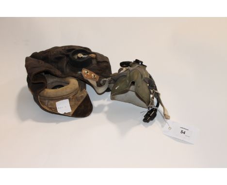 A FLYING HELMET A 1940,s type Flying Helmet with Gosport tube ear-pieces and later Oxygen Mask and plug-in microphone fitted.