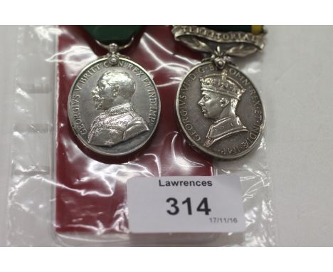 TWO EFFICIENCY MEDALS INCLUDING HANTS FORTRESS R E. A George V Territorial Force Efficiency Medal named to 285 Sapr G Abrams 