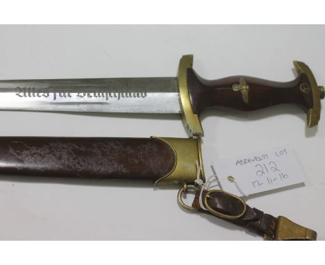 AN S A DAGGERA German SA Dagger complete with scabbard and belt clip, Wf on the crossguard. Makers name and Trade Mark for Ca