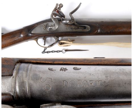 A BROWN BESS MUSKET & BAYONET. A 39" barrel Brown Bess musket with attached bayonet. The lockplate marked with Tower and Crow