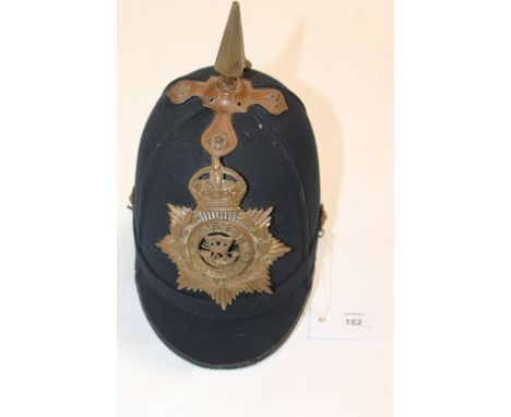 A SOMERSET LIGHT INFANTRY CLOTH HELMET. A blue cloth post 1902 pattern spike helmet, with Somersetshire helmet plate. Worn fo