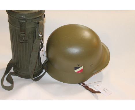 A COPY 1935 PATTERN GERMAN HELMET etc A copy or replica 35 pattern German helmet with army decals. Also a German Army style G