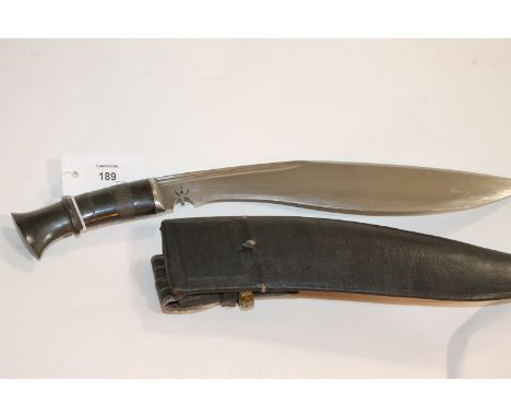 A BRACE OF KUKRIS. Two Kukri's of some quality, both with scabbards. The first with a horn grip inlaid with brass and bone de