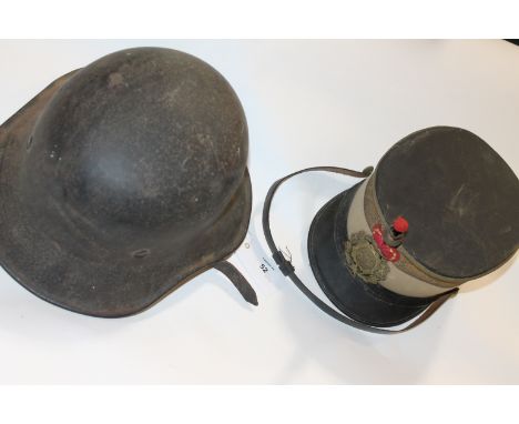 A GERMAN HELMET & SPANISH CAP. A steel German Helmet in the lightweight M1934 style, with webbing liner and no visible markin