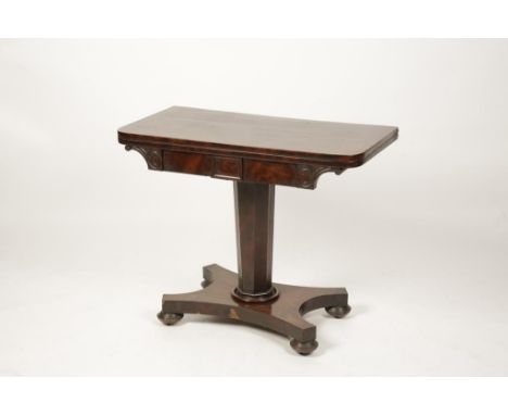 A REGENCY MAHOGANY FOLD TOP CARD TABLE, the rectangular top with rounded corners above a frieze with carved brackets, on a ta