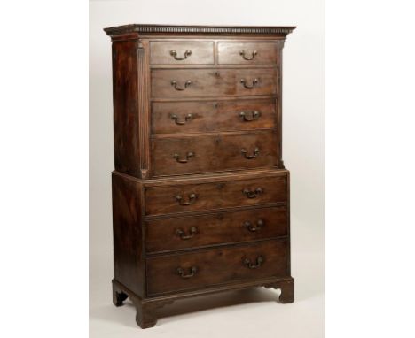 A GEORGE III MAHOGANY CHEST ON CHEST, the upper section with a dentil moulded cornice above two short and three long graduate