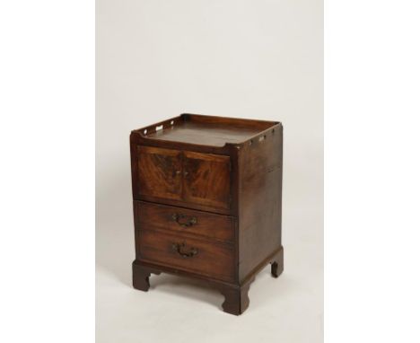 A GEORGE III MAHOGANY COMMODE, the rectangular top with raised and pierced border above a single cupboard door and a commode 