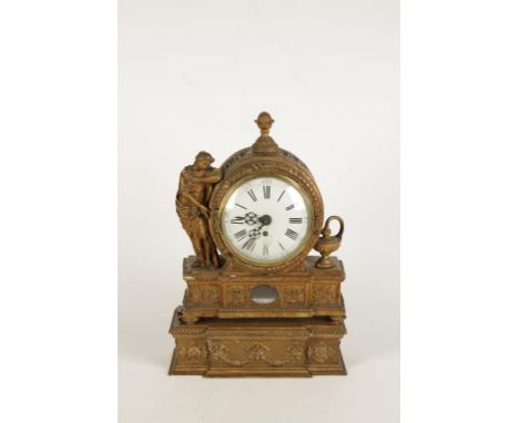 A CONTINENTAL GILTWOOD MANTEL CLOCK, the circular convex dial with Roman numerals within a barrel-form carved and gilt case f
