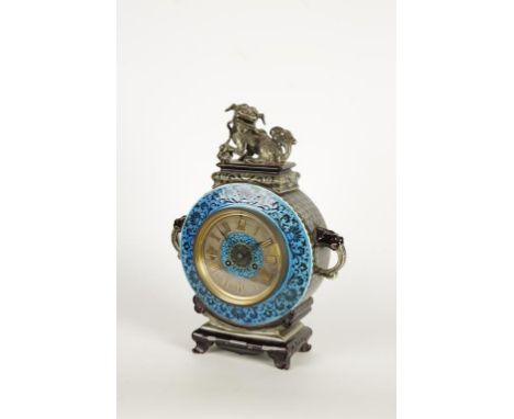 AN AESTHETIC PERIOD CERAMIC CASED MANTEL CLOCK, the circular dial within a circular case with turquoise foliate border and gr