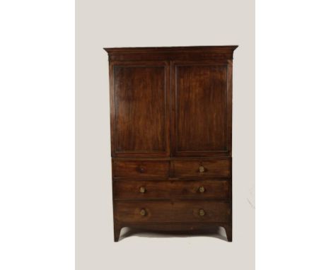 A GEORGE III MAHOGANY LINEN PRESS, the upper section with a moulded cornice above twin panelled doors, the lower section with