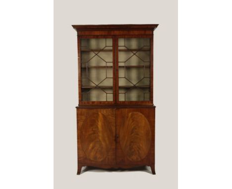 A GEORGE III MAHOGANY LIBRARY BOOKCASE, the upper section with twin astragal glazed doors enclosing a shelved interior above 