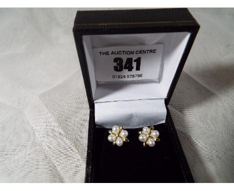 A pair of lady's 9 carat gold and pearl stud earrings