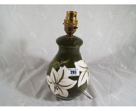 Moorcroft Pottery - A Moorcroft Pottery lamp base decorated in the Bermuda Lily pattern, 27cm (h) - Est £80 - £120