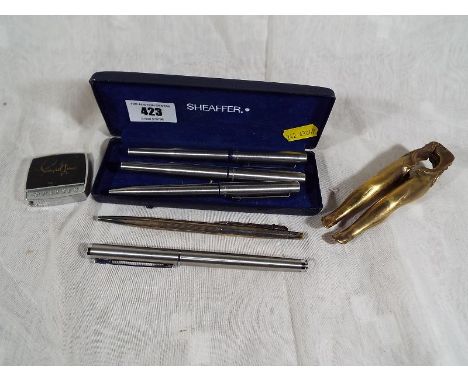 A Sheaffer display box containing two Parker fountain pens and a Parker ball point pen, Cyprea fountain pen and a Ciba - Gigy