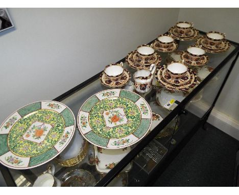 A late 19th century Royal Crown Derby tea service,  decorated in the Imari pattern comprising approximately 23 pieces and two