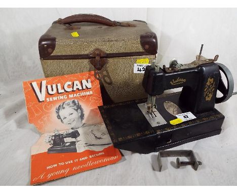 A Vulcan childs sewing machine with manual and case - Est £30 - £40