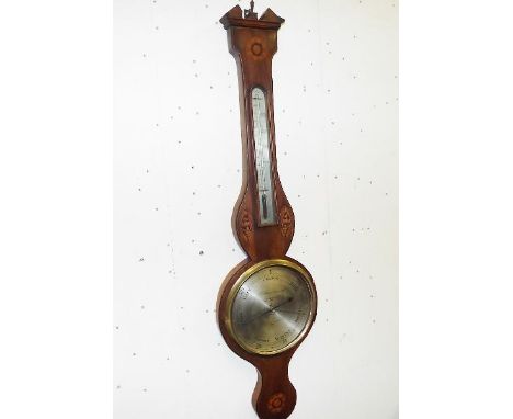 A mid-19th century mahogany cased mercury barometer and thermometer, the banjo-style case with inlaid stringing, floral round