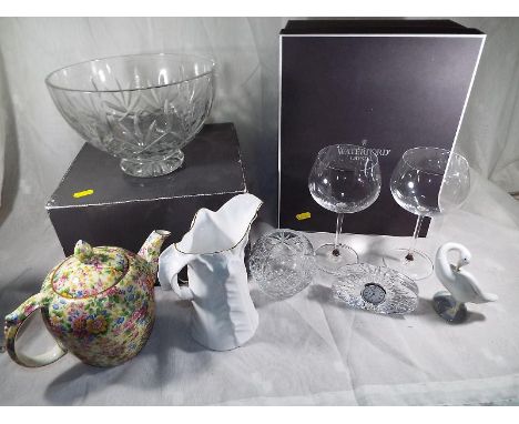 A quantity of Waterford Crystal to include wines glasses, fruit bowl, small mantel clock, a Royal Worcester water jug, a Llad