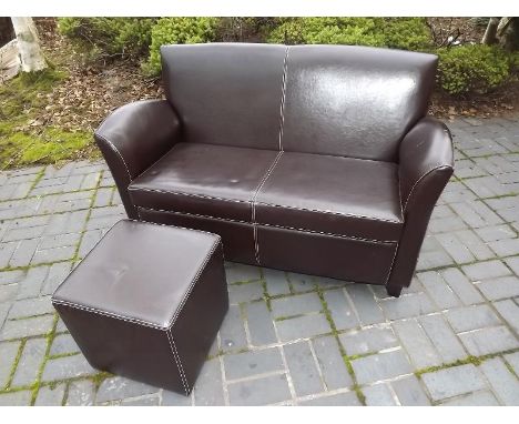 A brown leather two seater sofa 84cm (h) x 125cm (w)  x 72cm (d) - included in the lot in a brown leather cuboid footstool 42