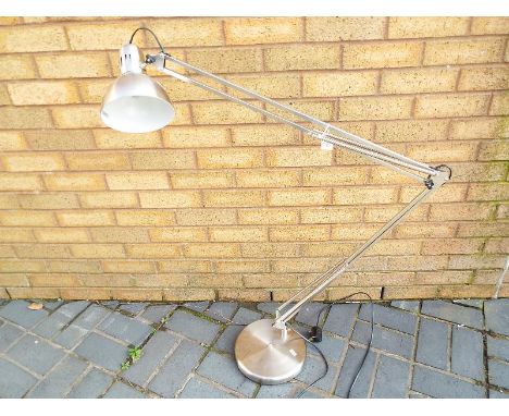 A contemporary chrome floor standing adjustable lamp, approximately 168cm (h) when fully extended