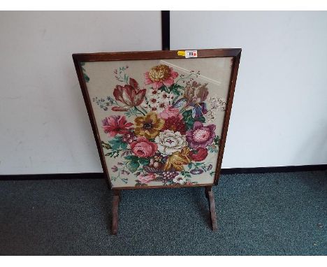 A fire screen tapestry which converts to a side table