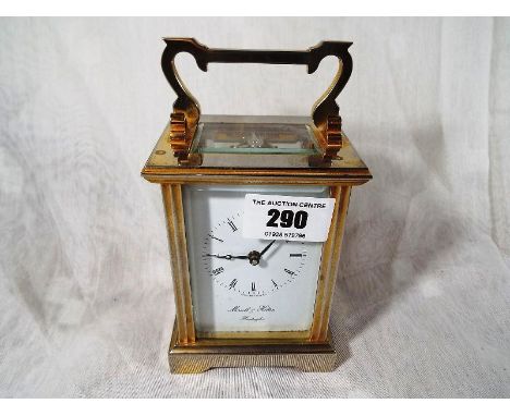 A late 19th century carriage clock with brass gorge case the white dial inscribed Morrell and Hilton of Huntingdon, Roman num