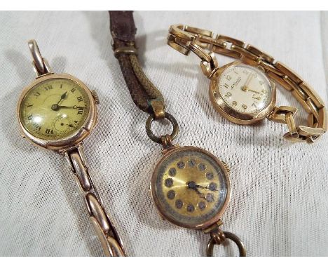 A mixed lot of three vintage wristwatches, each in 9 carat gold cases, two with straps also marked 9 carat, total weight appr