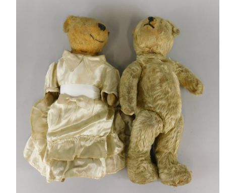Two similar early 20thC teddy bears, one straw filled, 26cm long
