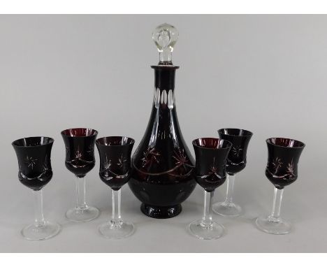 A collection of ruby tinted cut glass, to include spirit decanter, stopper and six glasses