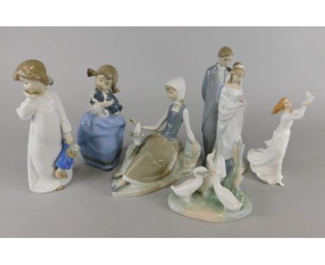 A collection of Spanish porcelain, to include a Lladro figure of a reclining young girl with a bird, Nao figure of a married 