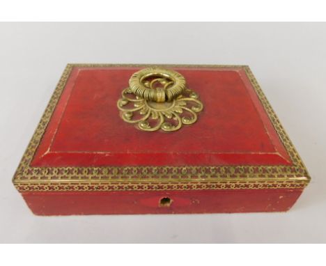 A 19thC red leather and gilt metal workbox, the hinged lid inset with a print depicting a Queen and attendants, the interior 