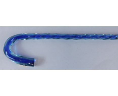 A late Victorian/early 20thC blue and clear glass twisted decorative walking stick, 93cm long