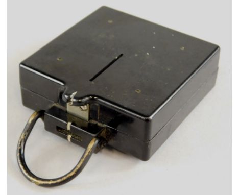 An unusual 1944 military issue bakelite compass, made by the Gramophone Company, impressed makers mark to underside, military
