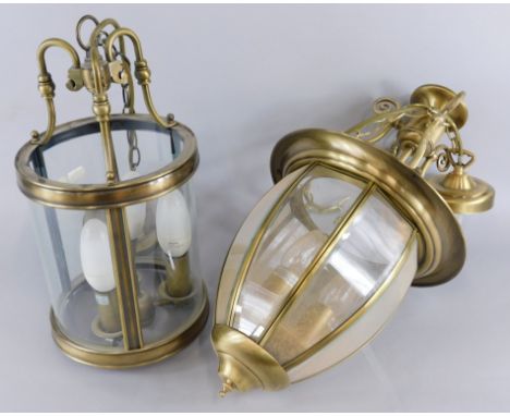 A modern brushed metal brass effect lantern, and another similar light fitting