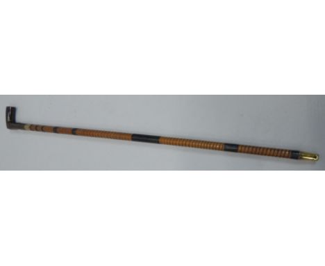 A late 19th/early 20thC sword stick, with shaped wooden handle and bound sheath or scabbard